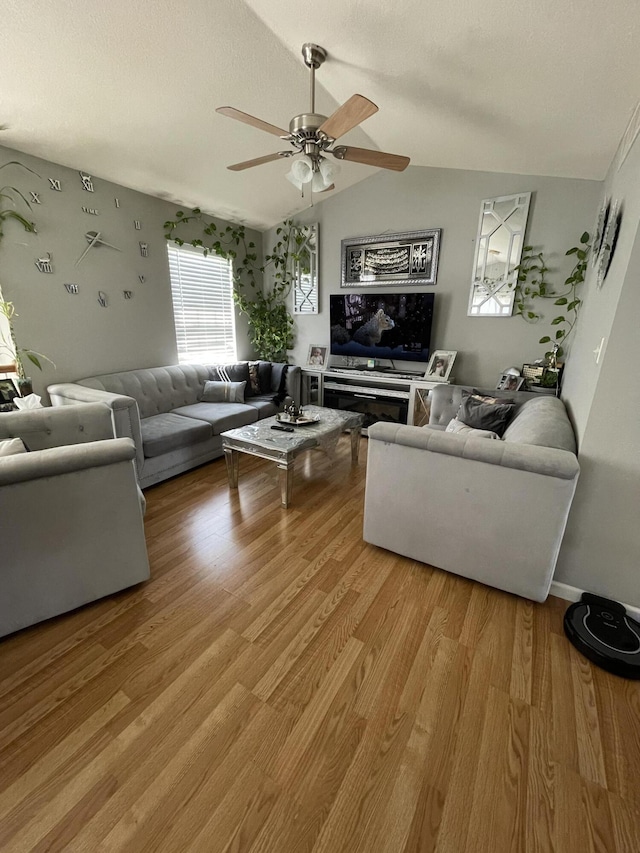 4011 Spring Cress Dr, Columbia, MO 65202 - living room with light wood finished floors, a ceiling fan, and vaulted ceiling