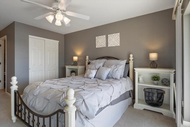 carpeted bedroom featuring baseboards, a closet, and ceiling fan
