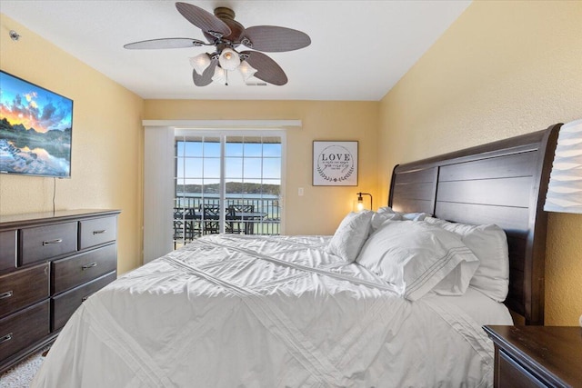 bedroom with ceiling fan and access to outside