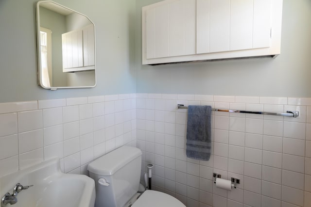 608 Westmount Ave, Columbia, MO 65203 - bathroom with tile walls, toilet, and wainscoting