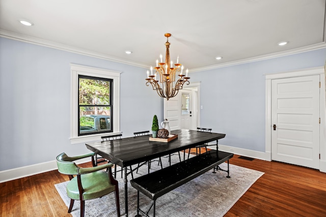 608 Westmount Ave, Columbia, MO 65203 - dining area with a chandelier, crown molding, wood finished floors, baseboards, and recessed lighting