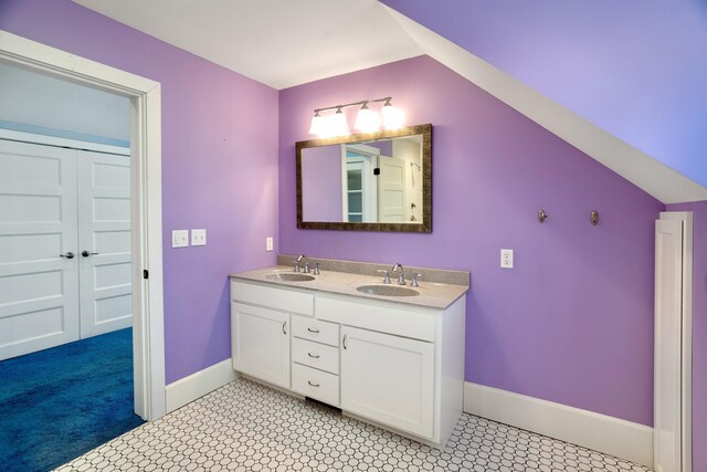 608 Westmount Ave, Columbia, MO 65203 - full bath featuring double vanity, baseboards, and lofted ceiling