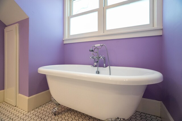 608 Westmount Ave, Columbia, MO 65203 - bathroom featuring a soaking tub and baseboards