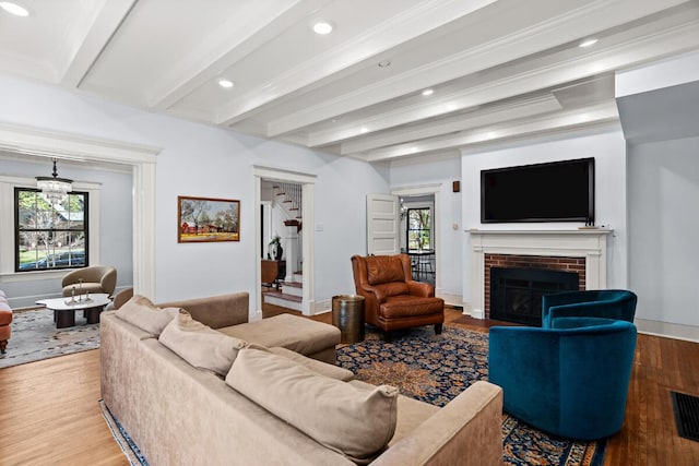 608 Westmount Ave, Columbia, MO 65203 - living room with beam ceiling, a brick fireplace, recessed lighting, wood finished floors, and baseboards