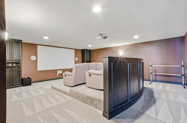 home theater featuring recessed lighting, light colored carpet, and baseboards
