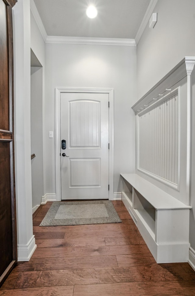 mudroom with baseboards, ornamental molding, and wood finished floors