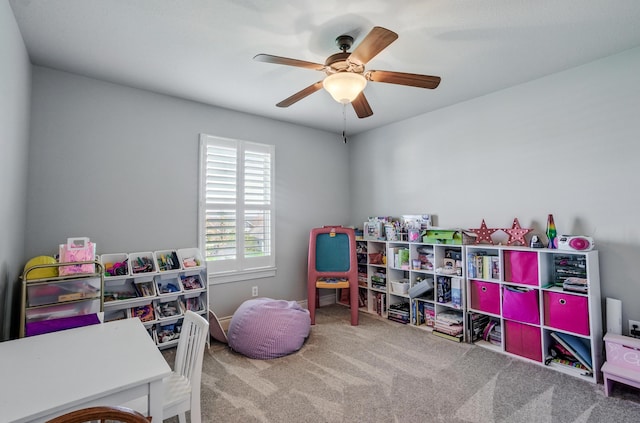 game room with ceiling fan and carpet