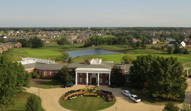 aerial view featuring a residential view, view of golf course, and a water view