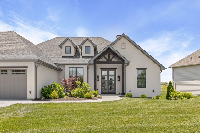 2816 Rivington Dr, Columbia, MO 65203 - view of front of house featuring stucco siding, french doors, a garage, roof with shingles, and a front lawn