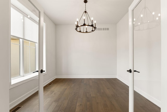 2816 Rivington Dr, Columbia, MO 65203 - spare room with a chandelier, dark wood-type flooring, and french doors