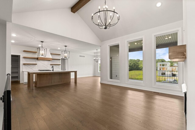 2816 Rivington Dr, Columbia, MO 65203 - unfurnished living room featuring a chandelier, beamed ceiling, dark wood-type flooring, recessed lighting, and high vaulted ceiling