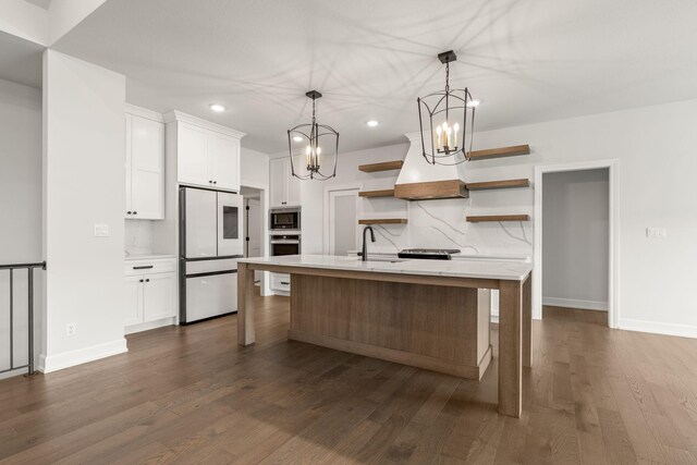 2816 Rivington Dr, Columbia, MO 65203 - kitchen with stainless steel appliances, open shelves, recessed lighting, white cabinets, and a chandelier