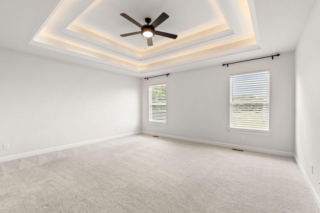 2816 Rivington Dr, Columbia, MO 65203 - unfurnished room featuring a raised ceiling, ceiling fan, and light colored carpet
