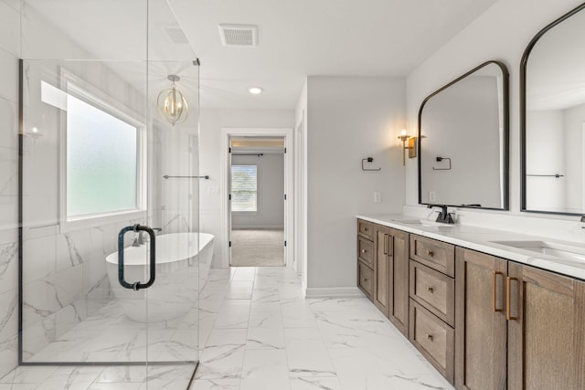 2816 Rivington Dr, Columbia, MO 65203 - bathroom with double vanity, a soaking tub, marble finish floors, and a chandelier