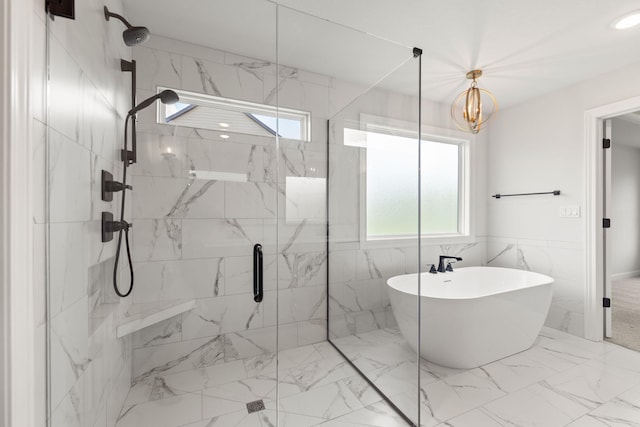 2816 Rivington Dr, Columbia, MO 65203 - full bathroom featuring a marble finish shower, a freestanding tub, marble finish flooring, and a chandelier