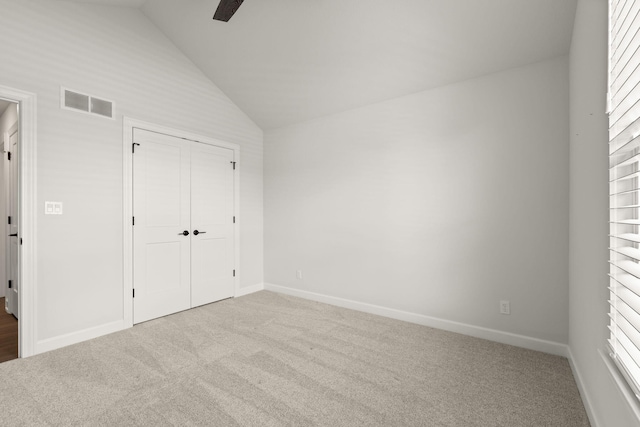 2816 Rivington Dr, Columbia, MO 65203 - unfurnished bedroom with carpet, lofted ceiling, ceiling fan, and a closet