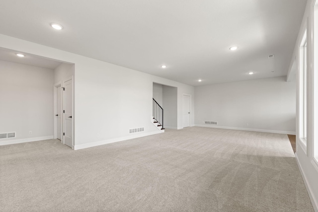 2816 Rivington Dr, Columbia, MO 65203 - unfurnished room with light carpet, stairs, and recessed lighting