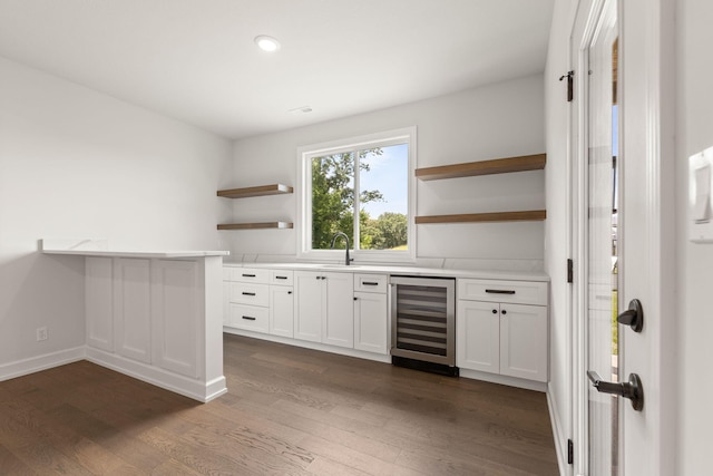 2816 Rivington Dr, Columbia, MO 65203 - bar area with beverage cooler, dark wood-style flooring, and recessed lighting