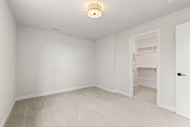 2816 Rivington Dr, Columbia, MO 65203 - unfurnished bedroom with light carpet, a walk in closet, and a closet