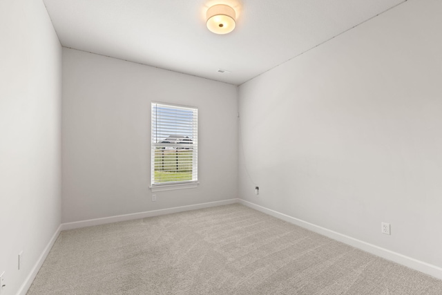 2816 Rivington Dr, Columbia, MO 65203 - carpeted empty room featuring baseboards