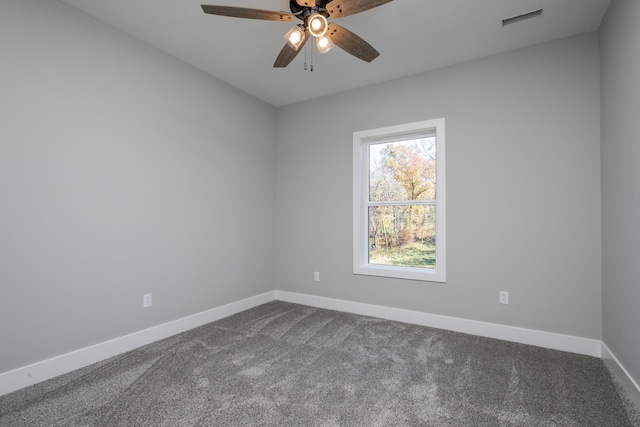 700 Brockton Dr, Columbia, MO 65201 - spare room with baseboards, dark colored carpet, and a ceiling fan