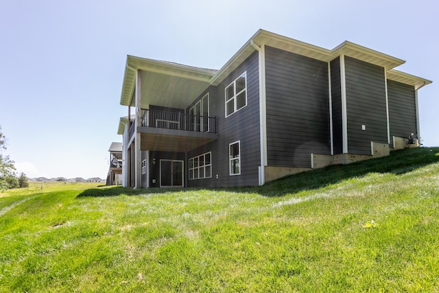 700 Brockton Dr, Columbia, MO 65201 - rear view of property with a lawn and a balcony