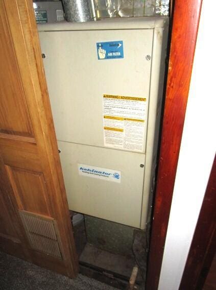 614 S Central St, Centralia, MO 65240 - utility room featuring heating unit