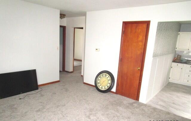 614 S Central St, Centralia, MO 65240 - unfurnished bedroom featuring light colored carpet