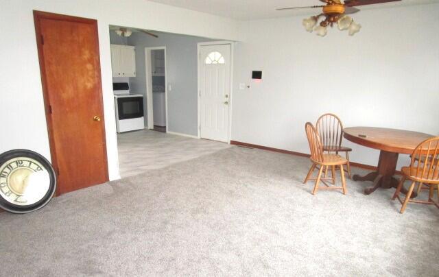 614 S Central St, Centralia, MO 65240 - carpeted dining area featuring ceiling fan and baseboards