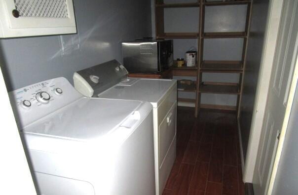 614 S Central St, Centralia, MO 65240 - washroom featuring dark wood-style flooring, washer and dryer, and laundry area