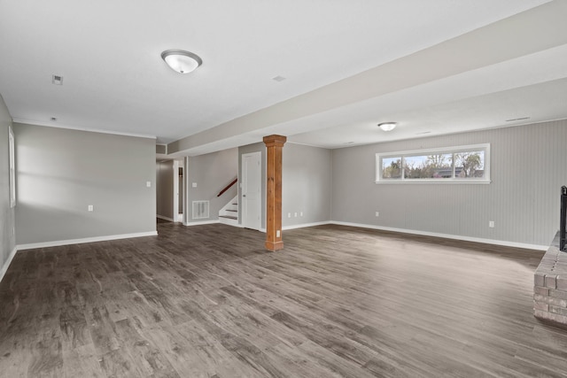 basement with stairway, baseboards, wood finished floors, and visible vents