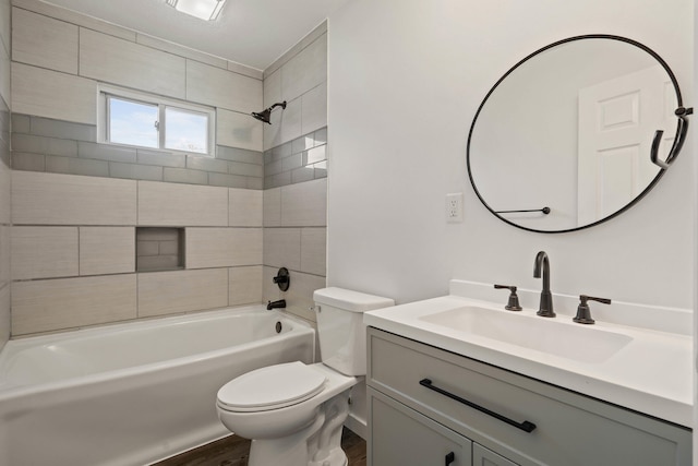full bath featuring toilet, vanity, wood finished floors, and  shower combination