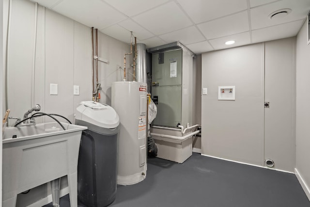 utilities featuring electric water heater and a sink