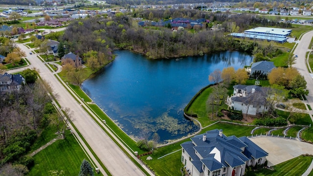 birds eye view of property featuring a water view and a residential view