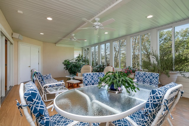 sunroom / solarium featuring ceiling fan, outdoor dining space, and plenty of natural light