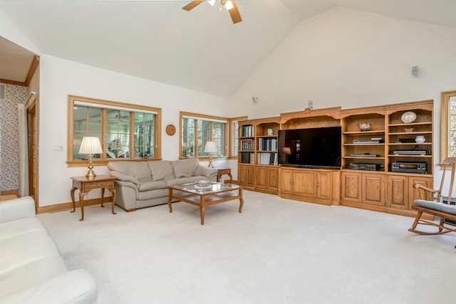 living room with light carpet, a ceiling fan, a healthy amount of sunlight, and high vaulted ceiling