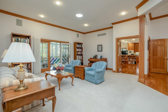 living area with carpet flooring, visible vents, ornamental molding, and recessed lighting