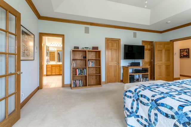 bedroom featuring carpet flooring, baseboards, a raised ceiling, and ornamental molding