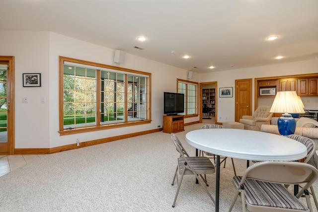 dining area featuring light colored carpet, visible vents, baseboards, and recessed lighting
