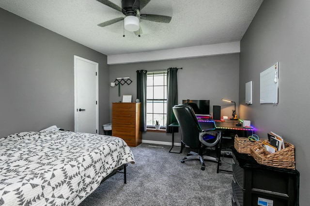 bedroom with baseboards, carpet flooring, a textured ceiling, and ceiling fan