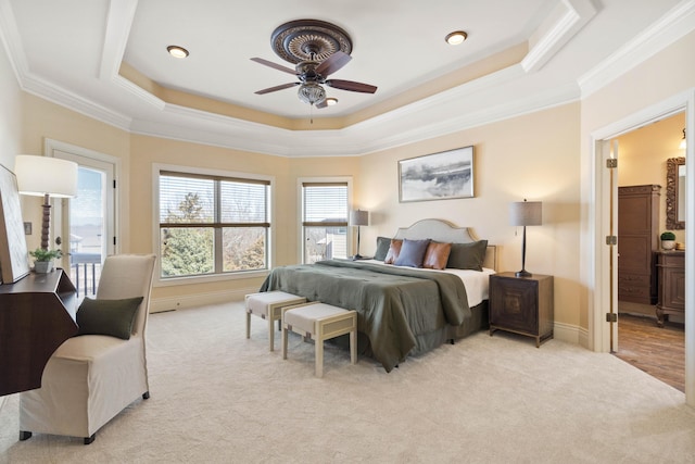 3207 Rivington Dr, Columbia, MO 65203 - bedroom featuring ornamental molding, a tray ceiling, light colored carpet, and ceiling fan