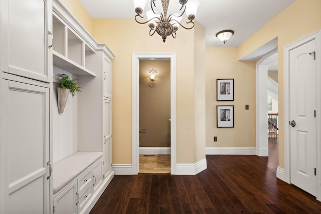 3207 Rivington Dr, Columbia, MO 65203 - mudroom with dark wood finished floors, a chandelier, and baseboards