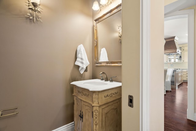 3207 Rivington Dr, Columbia, MO 65203 - bathroom featuring wood finished floors and vanity