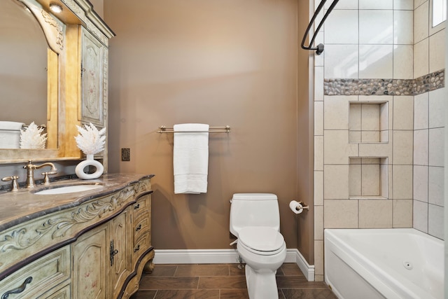 3207 Rivington Dr, Columbia, MO 65203 - full bath featuring baseboards, toilet, vanity, and tub / shower combination