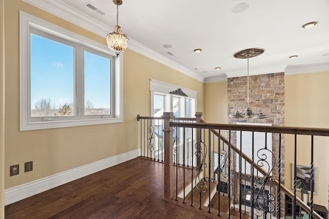3207 Rivington Dr, Columbia, MO 65203 - hall with dark wood-style floors, a chandelier, an upstairs landing, baseboards, and ornamental molding