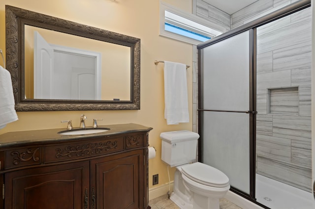 3207 Rivington Dr, Columbia, MO 65203 - bathroom with a shower stall, toilet, vanity, and baseboards