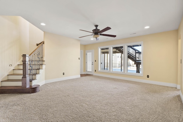 3207 Rivington Dr, Columbia, MO 65203 - unfurnished living room featuring carpet floors, a ceiling fan, stairs, baseboards, and recessed lighting