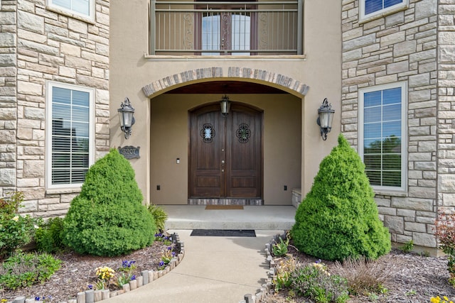 3207 Rivington Dr, Columbia, MO 65203 - entrance to property with stone siding, stucco siding, and a balcony