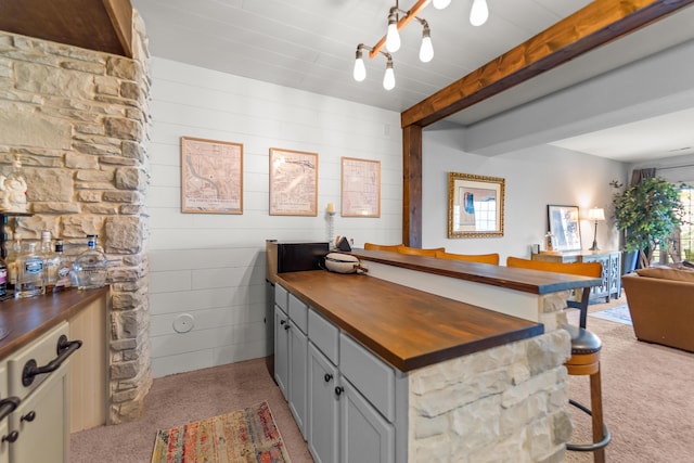 5109 Newbury Way, Columbia, MO 65203 - bar featuring light colored carpet and beam ceiling