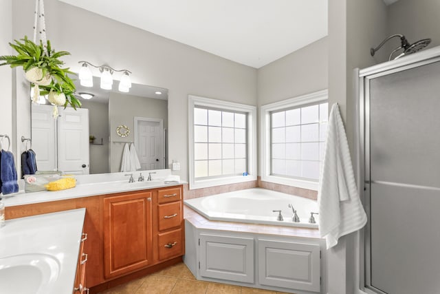 5109 Newbury Way, Columbia, MO 65203 - bathroom featuring tile patterned floors, vanity, a garden tub, and a stall shower
